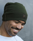 man modeling green beanie