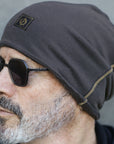 A man modeling the One Golden Thread OG Cloud Beanie in Slate