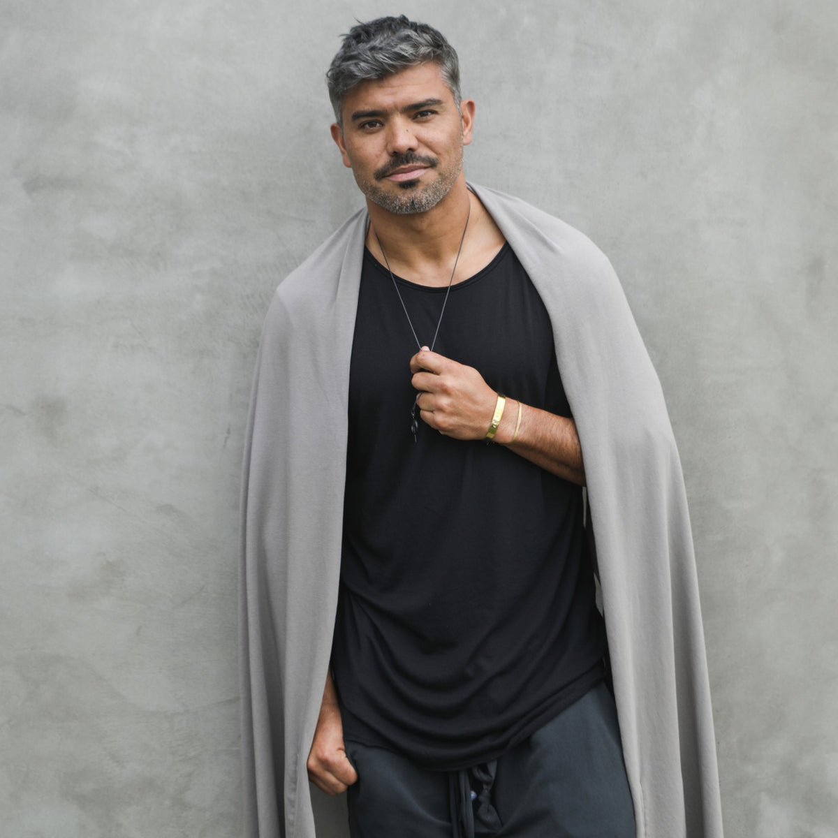 Male modeling grey fleece scarf