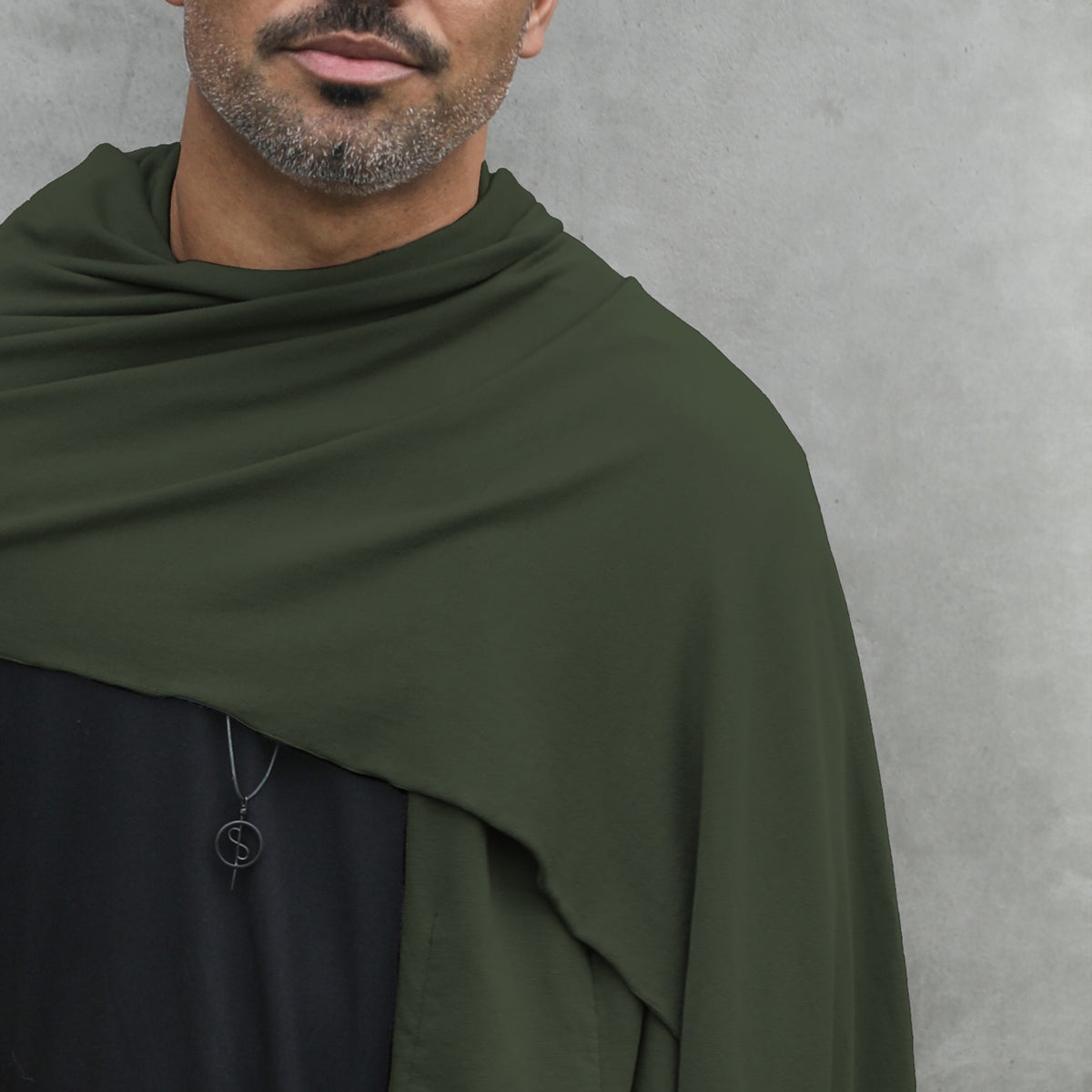 Man modeling green fleece scarf