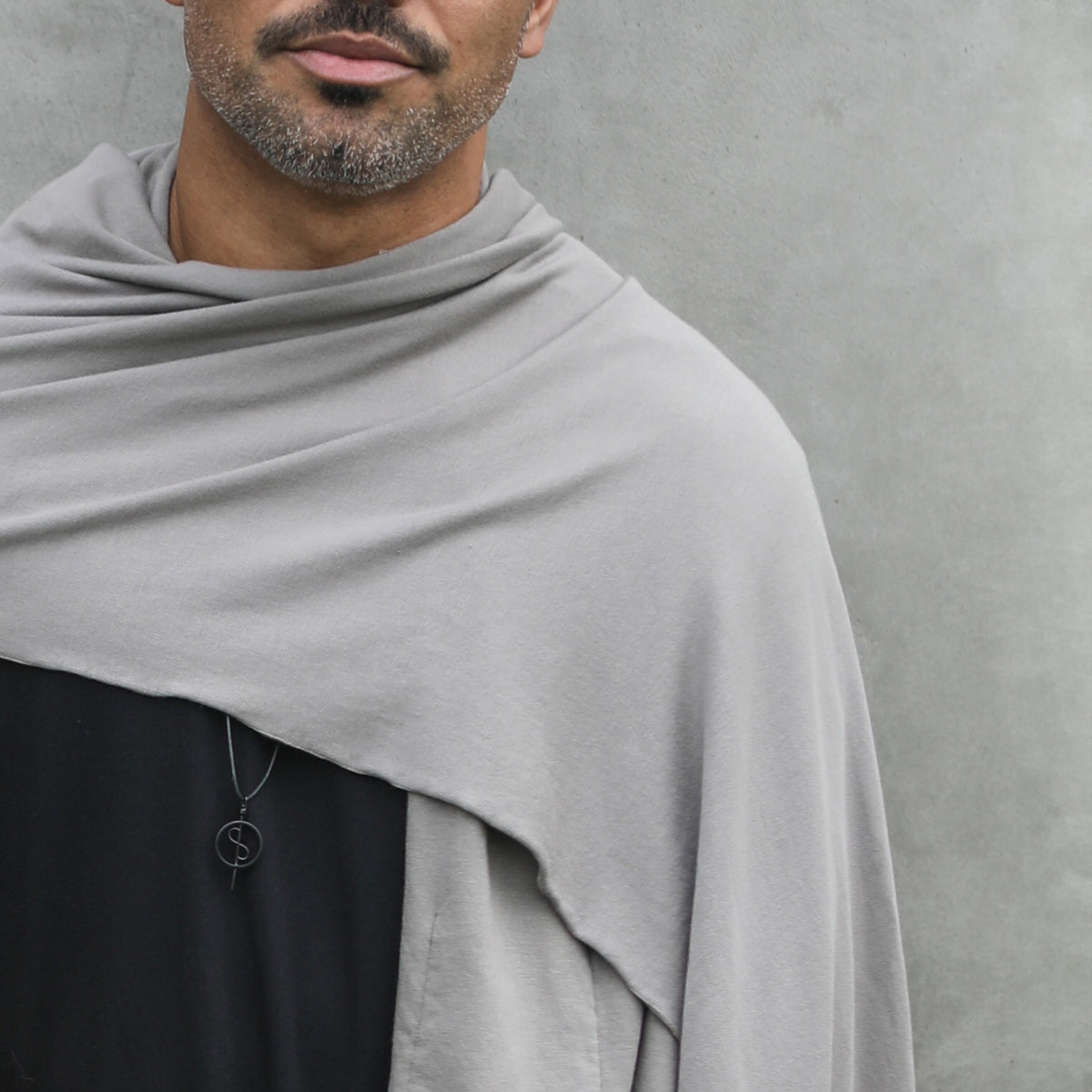 Male modeling grey fleece scarf