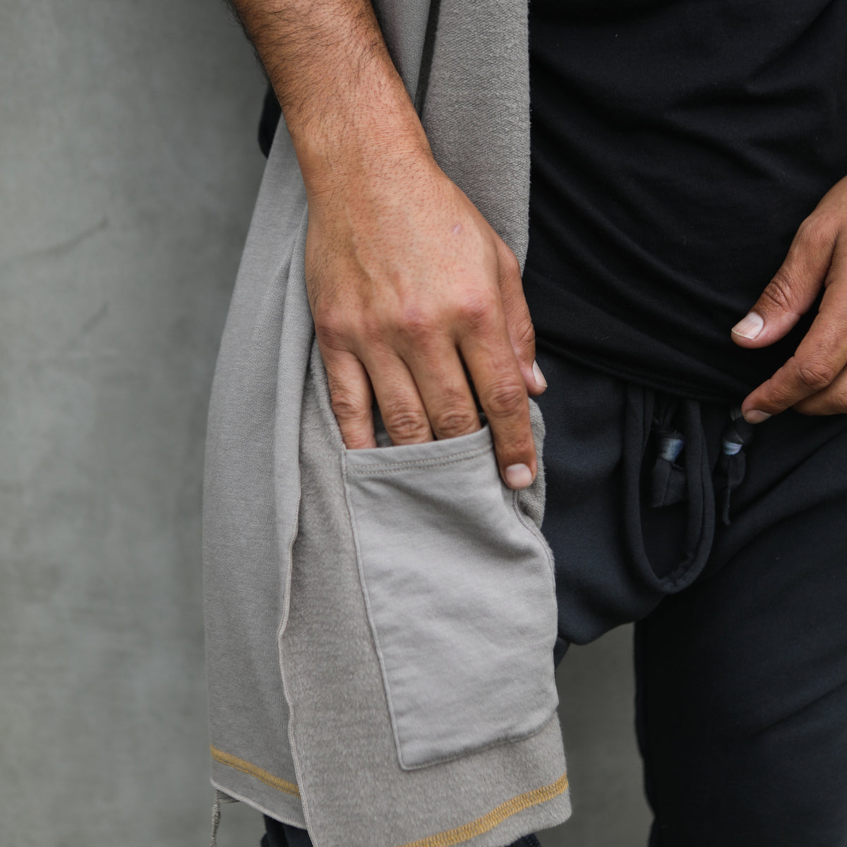 Male modeling grey fleece scarf