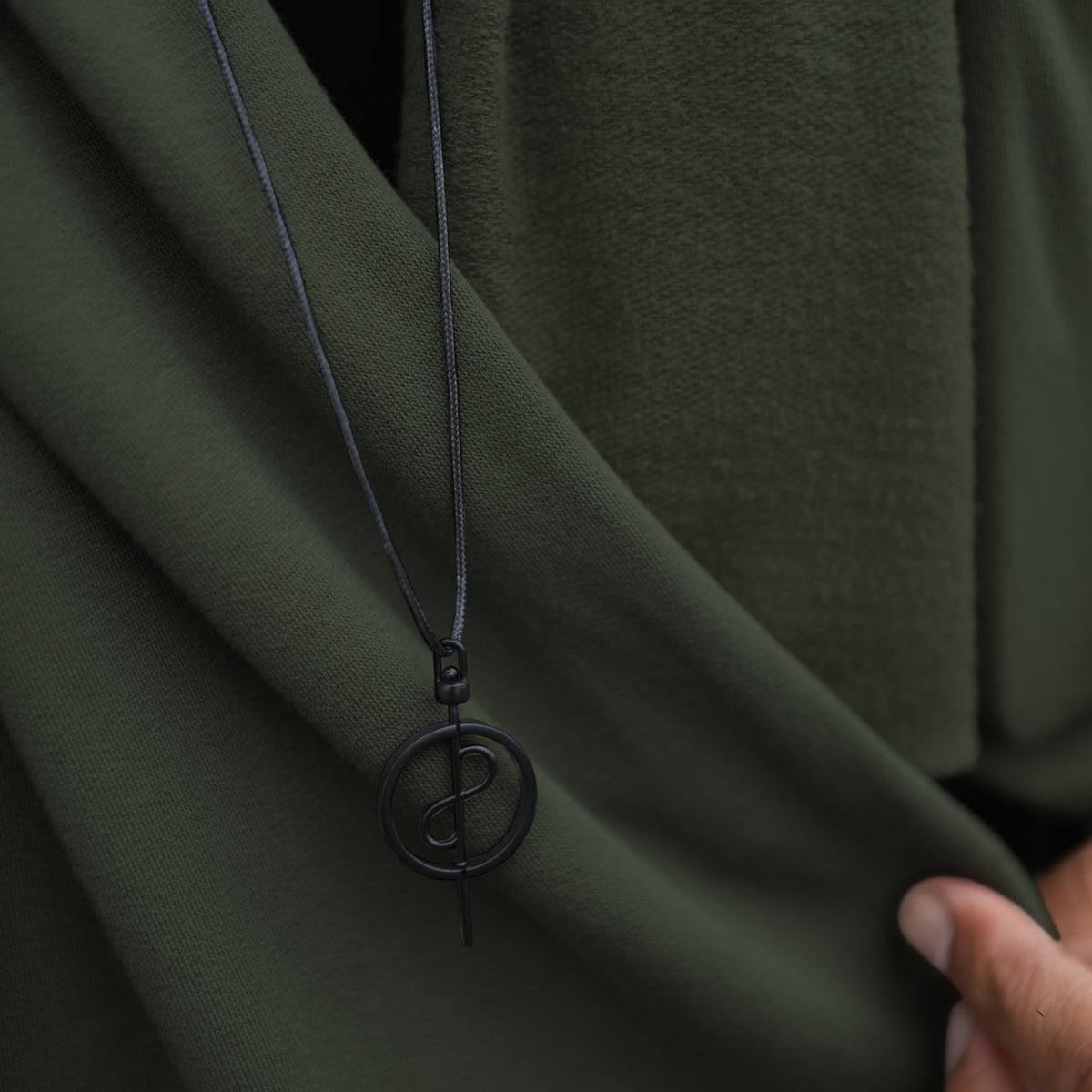 Man modeling green fleece scarf