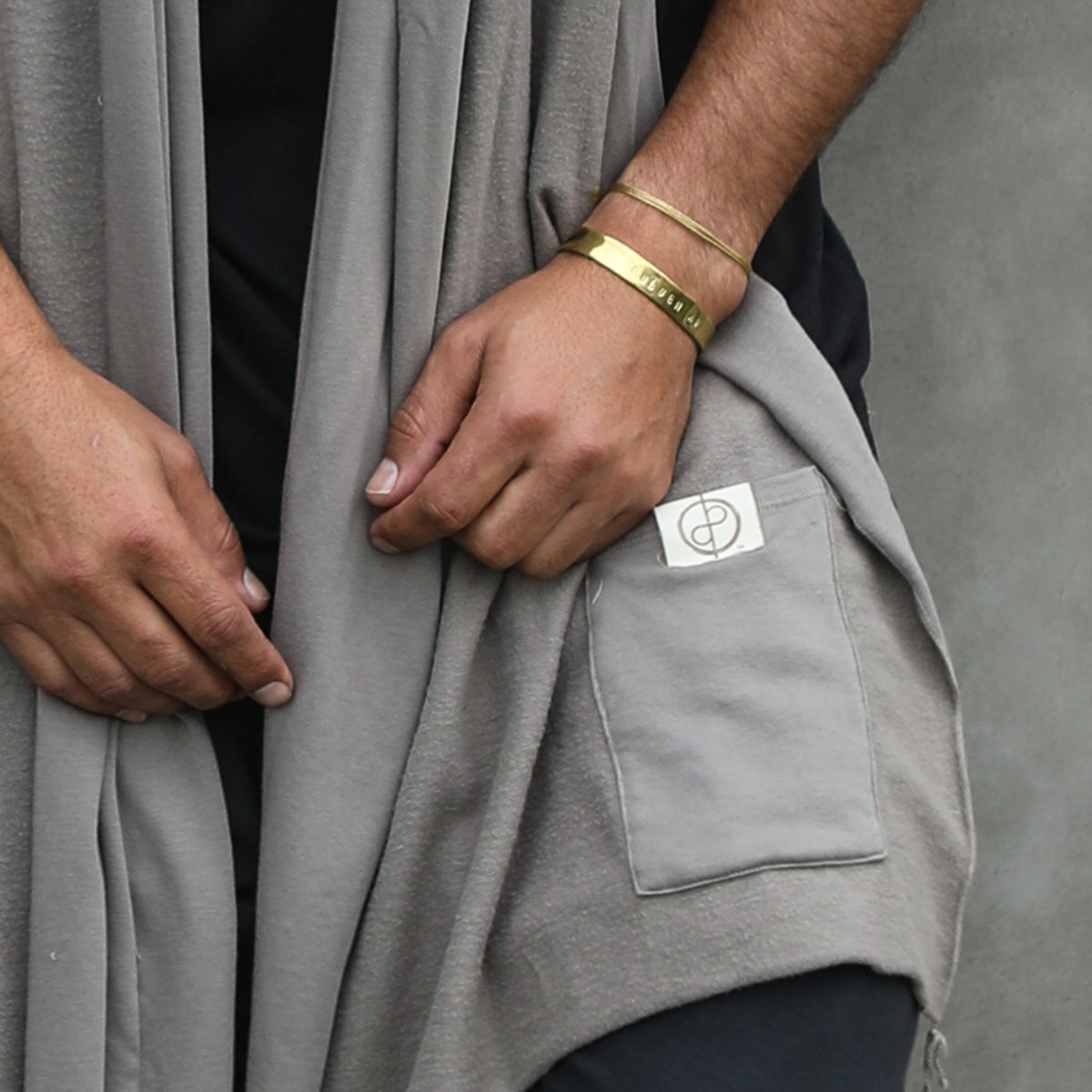 Male modeling grey fleece scarf