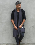 Man modeling blue fleece scarf