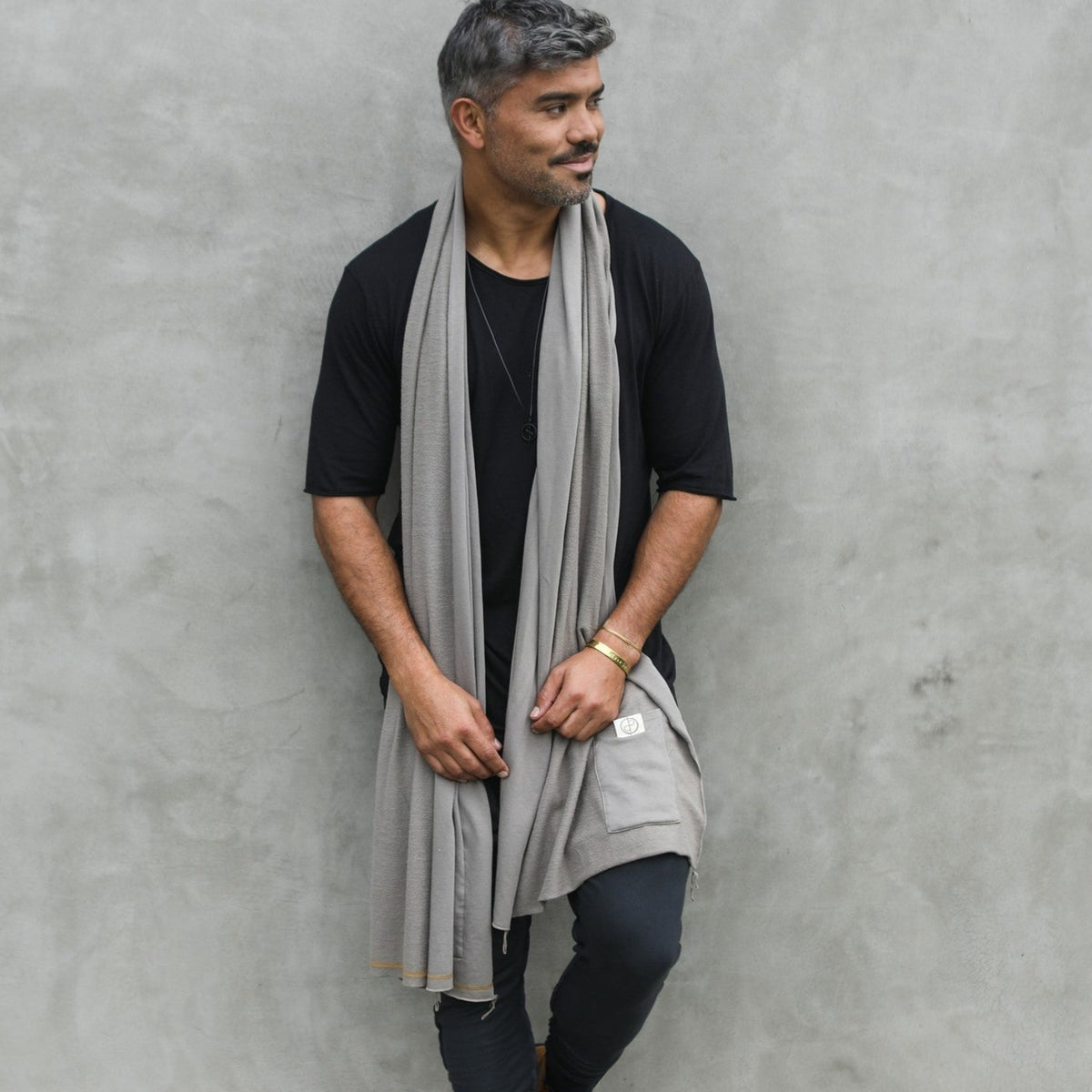 Male modeling grey fleece scarf