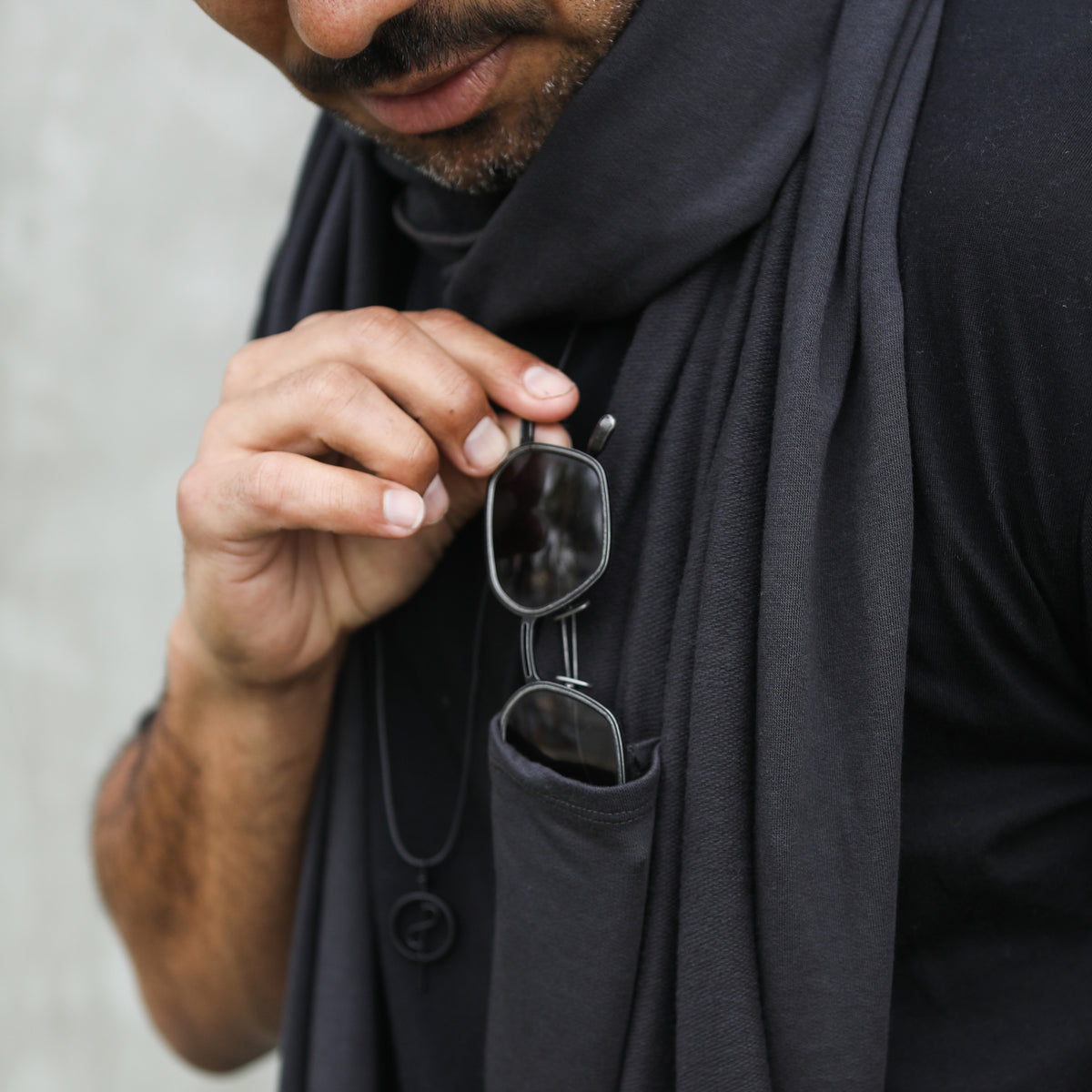 Man modeling slate fleece scarf
