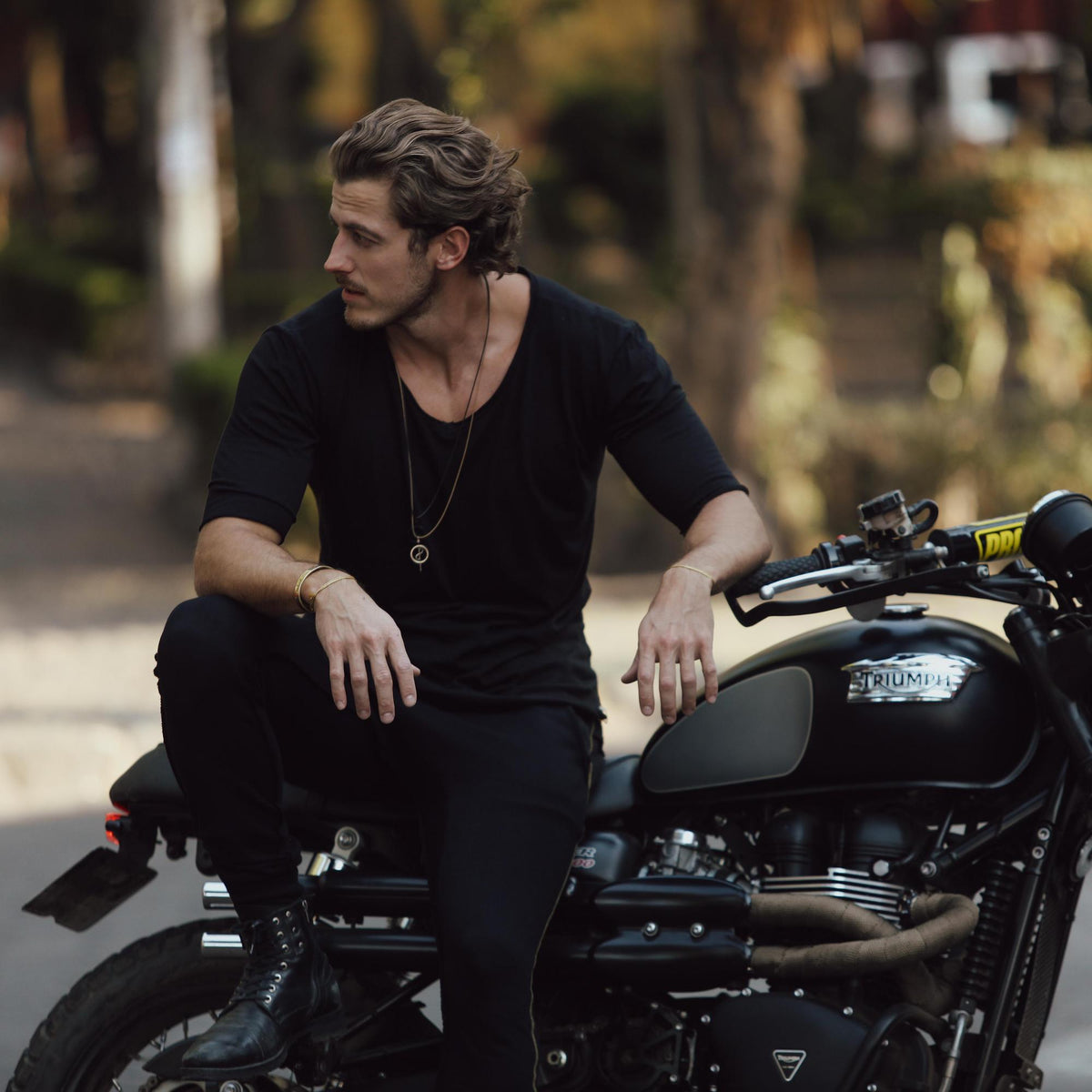 Male modeling black v neck shirt 