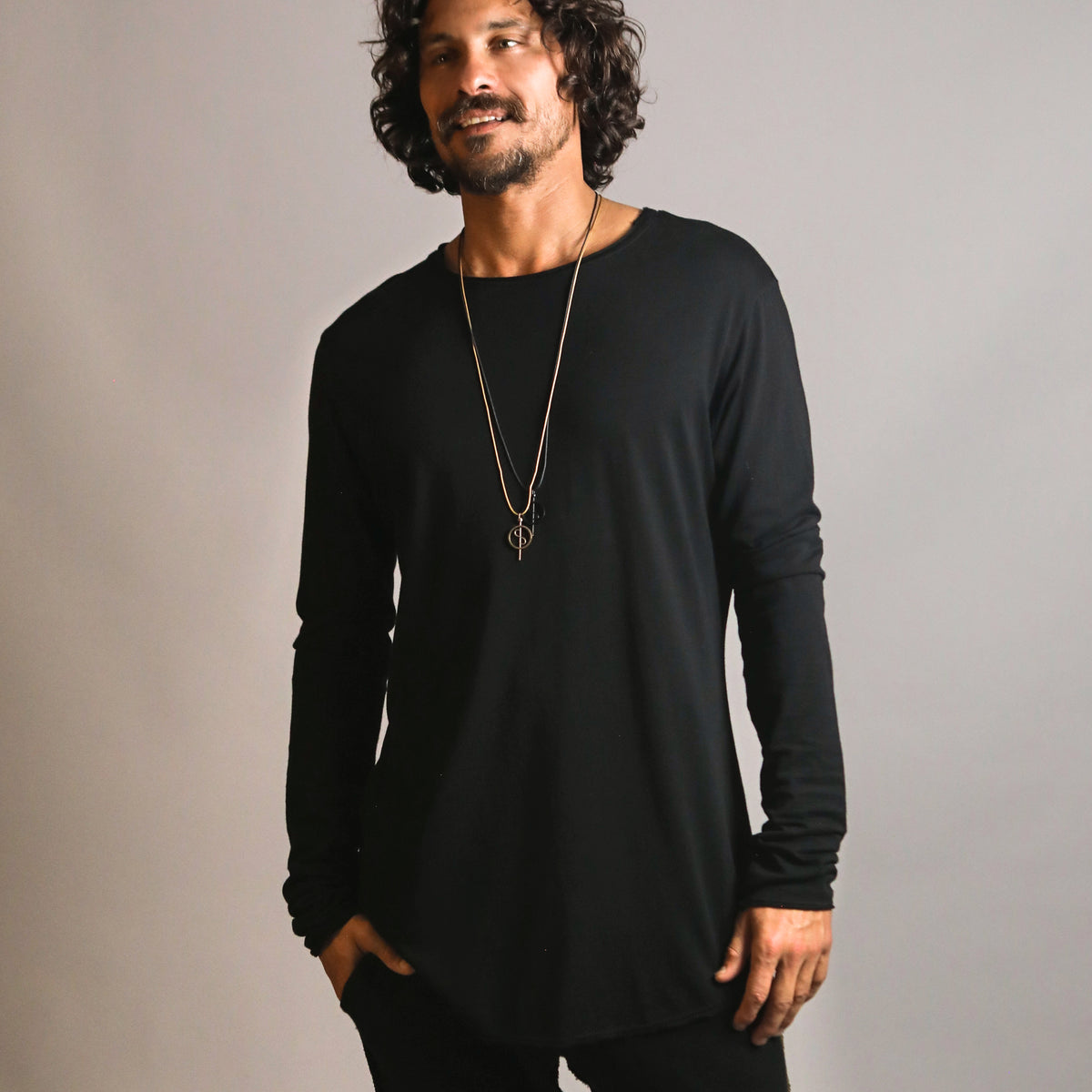 Man modeling a long sleeve crew shirt in black