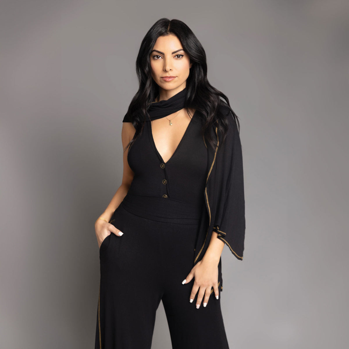 woman modeling the infinite bodysuit in black