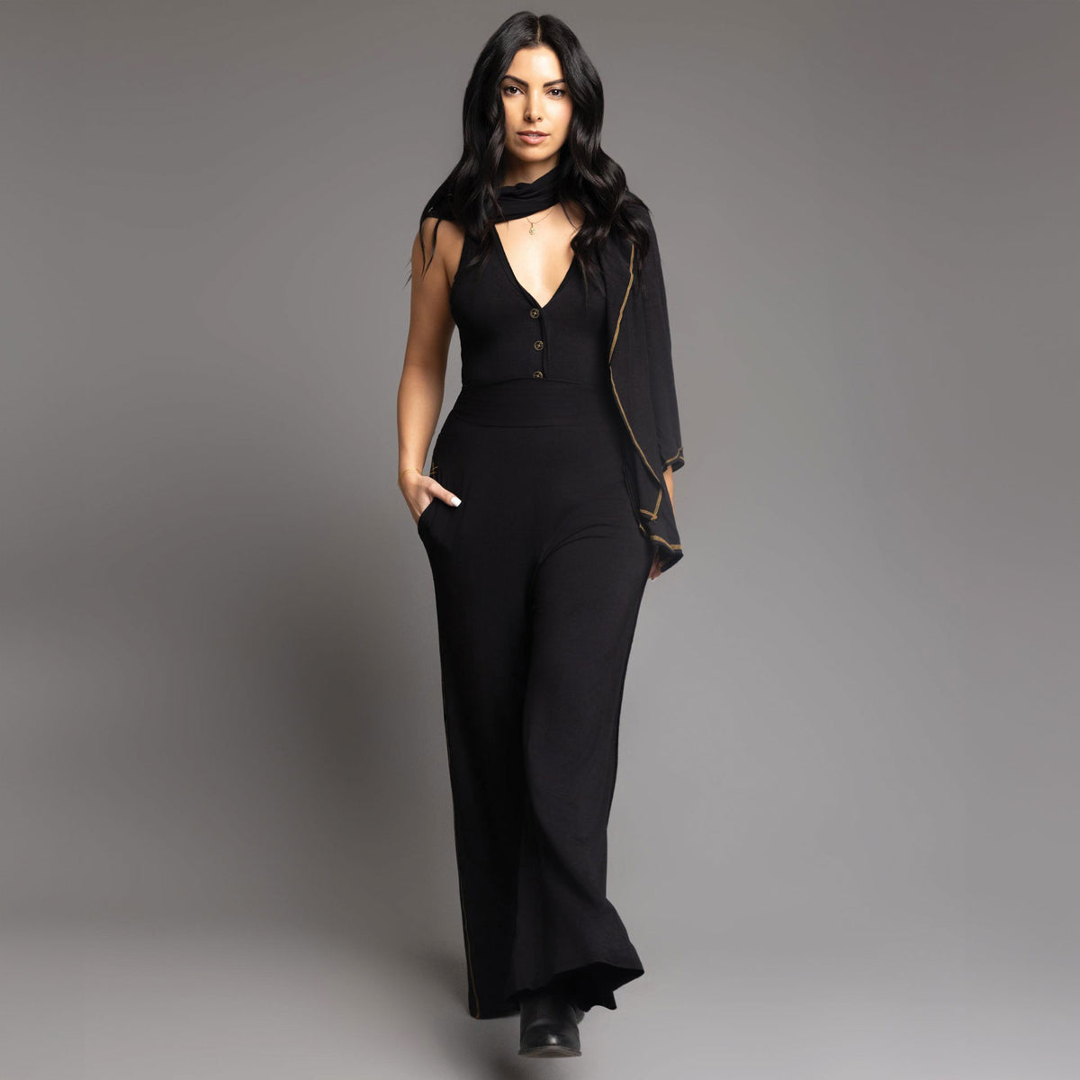 woman modeling the infinite bodysuit in black