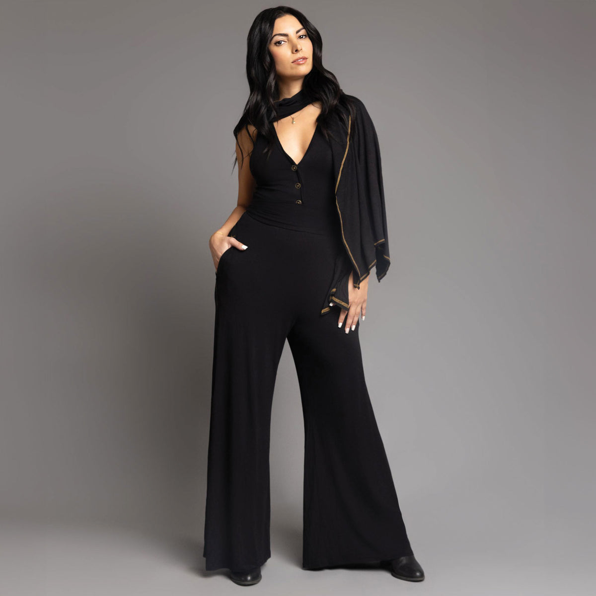 woman modeling the infinite bodysuit in black