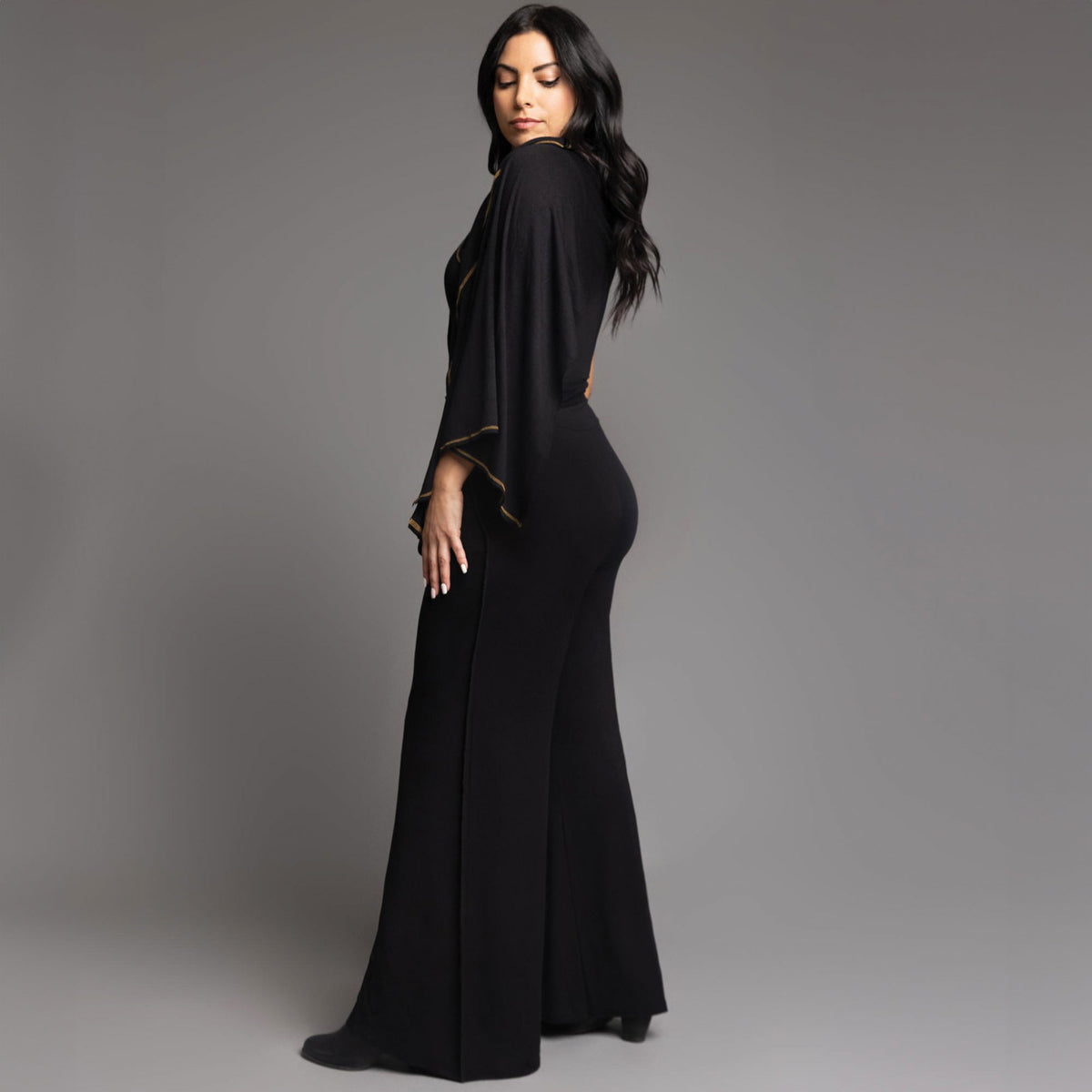 woman modeling the infinite bodysuit in black