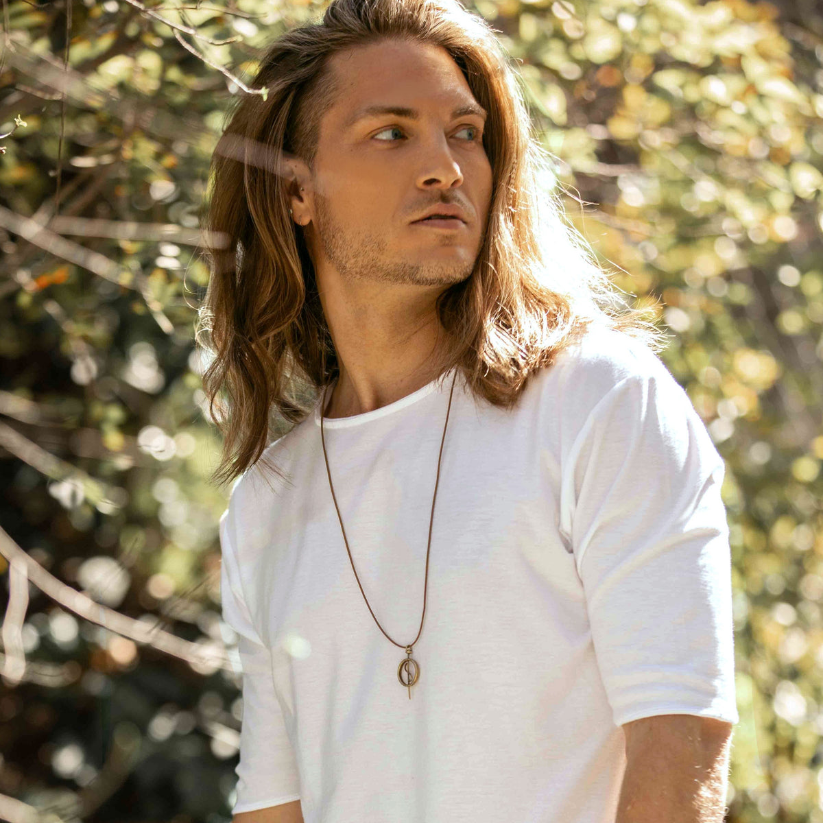 A model wearing the 108 Talisman Necklace in Antique Gold
