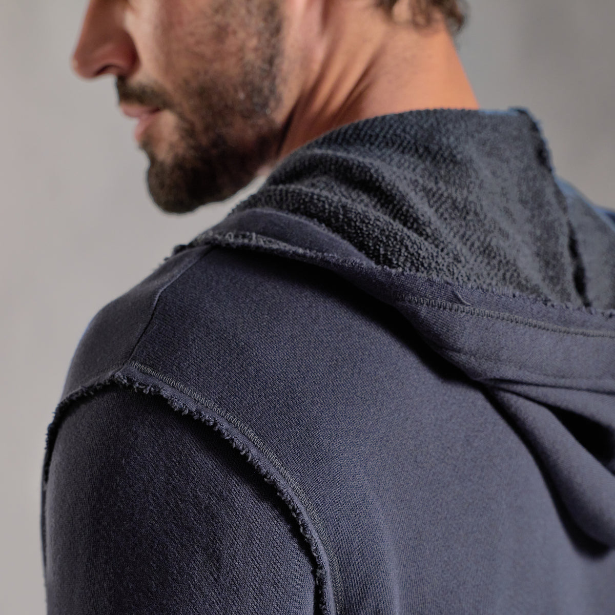 Male modeling charcoal blue hoodie 