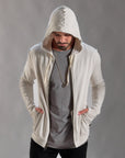 Man modeling a white stone hoodie 
