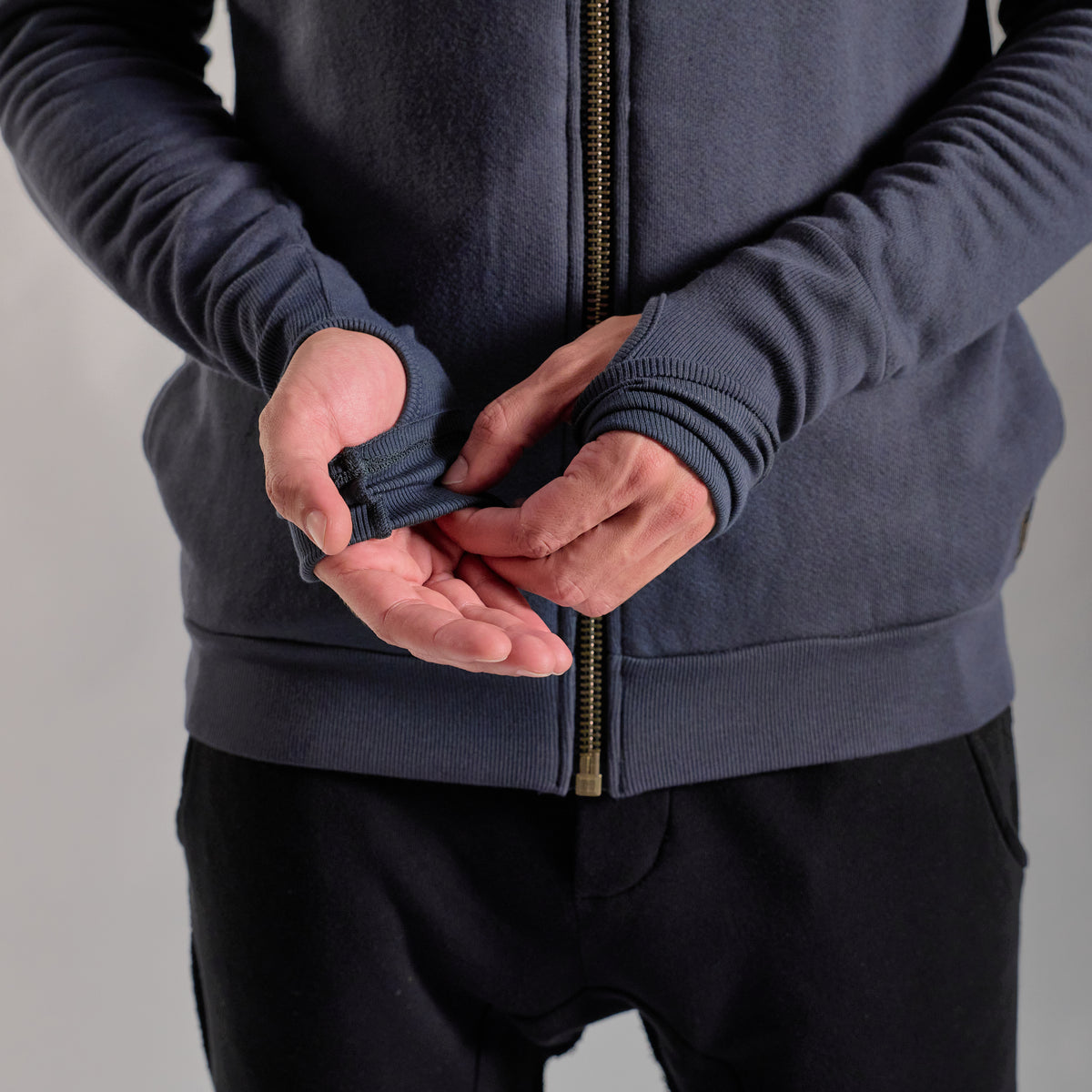 Male modeling charcoal blue hoodie 
