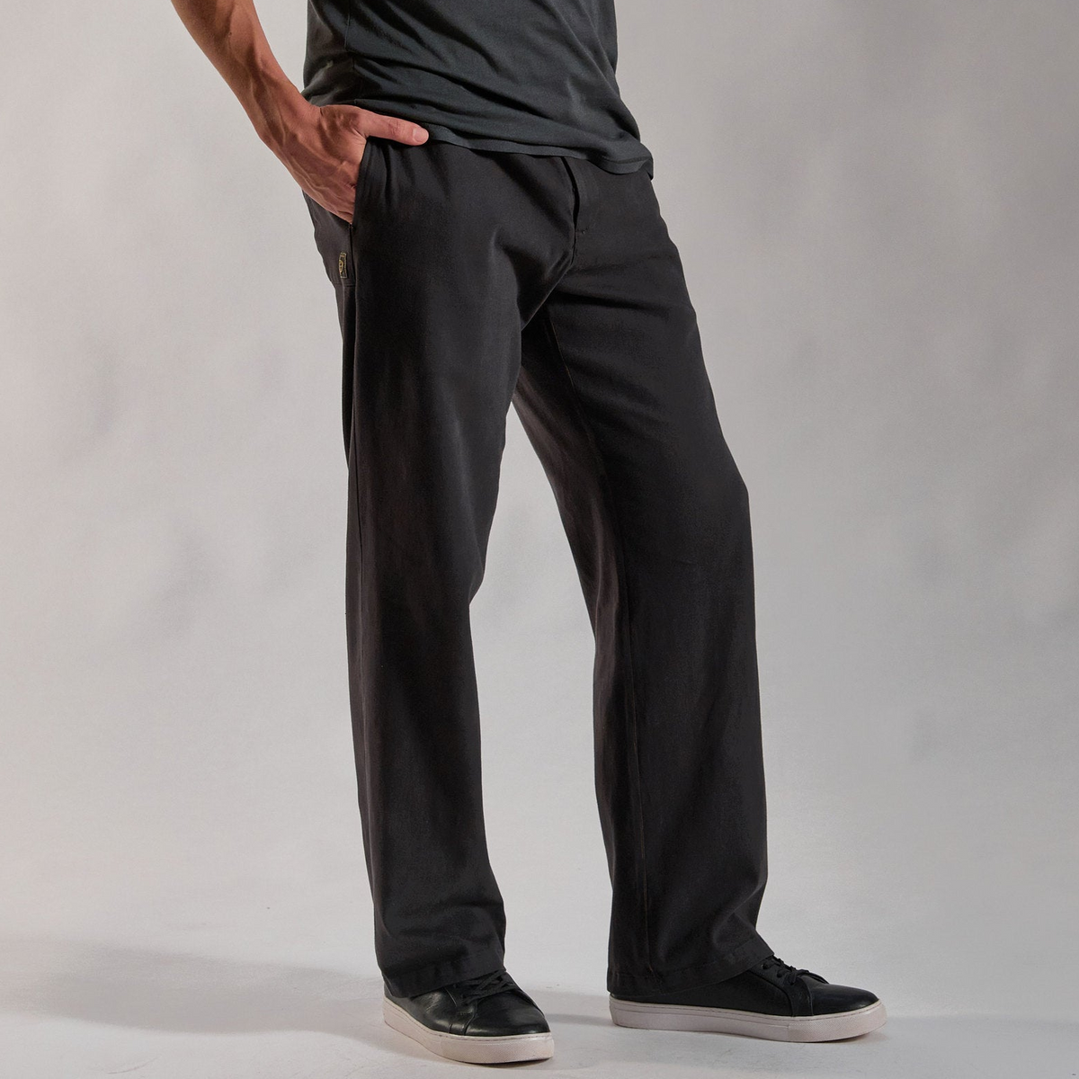 male modeling black pants in slate