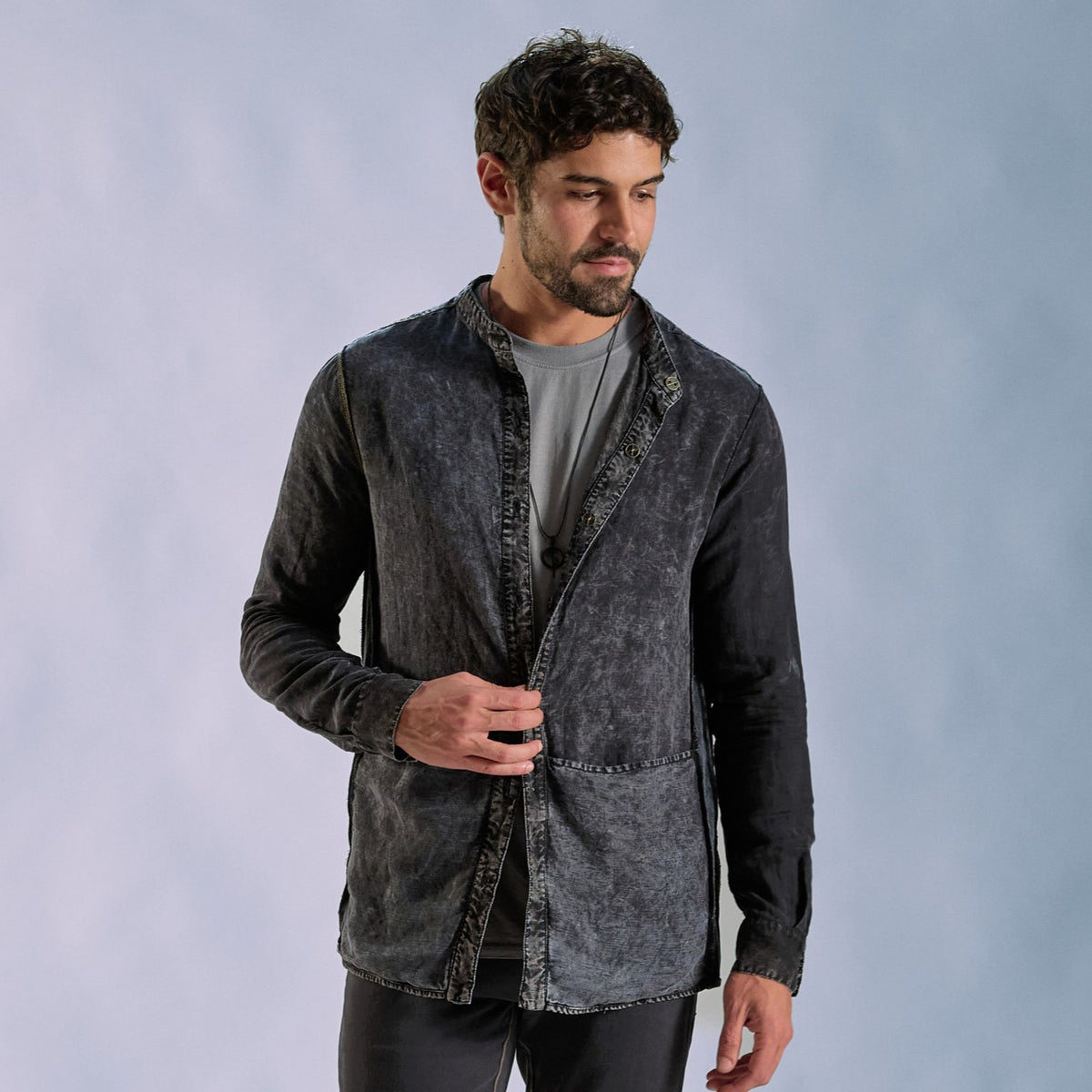 Male modeling dark mineral shacket