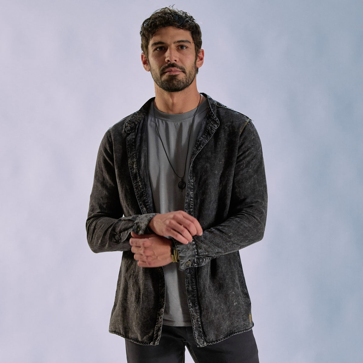 Male modeling dark mineral shacket
