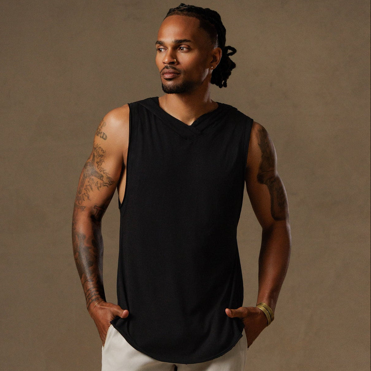 male modeling black hooded tree tank