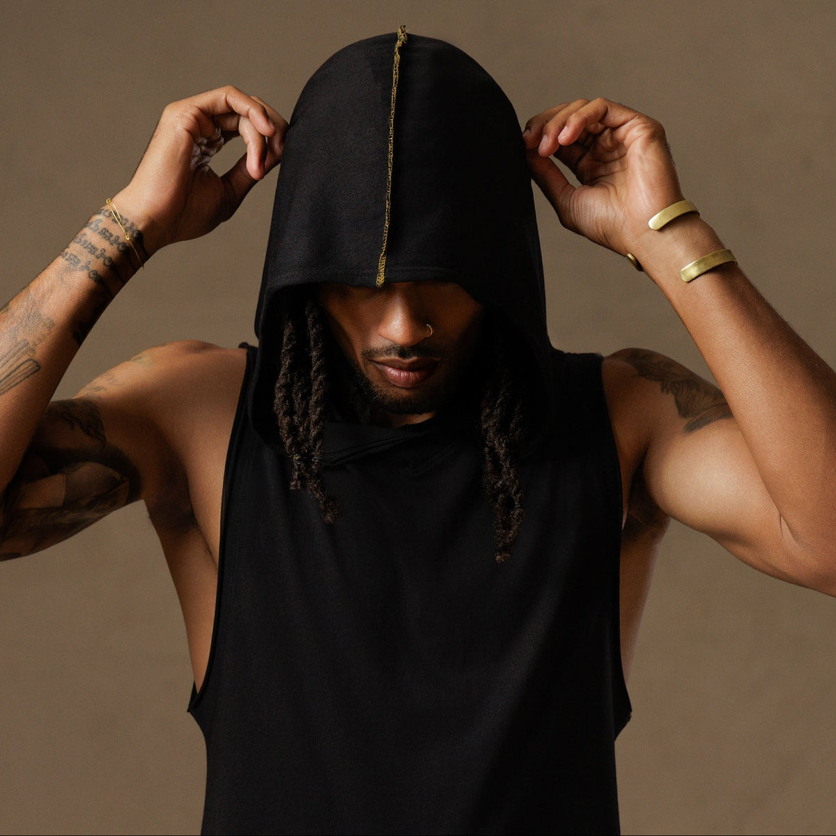 male modeling black hooded tree tank
