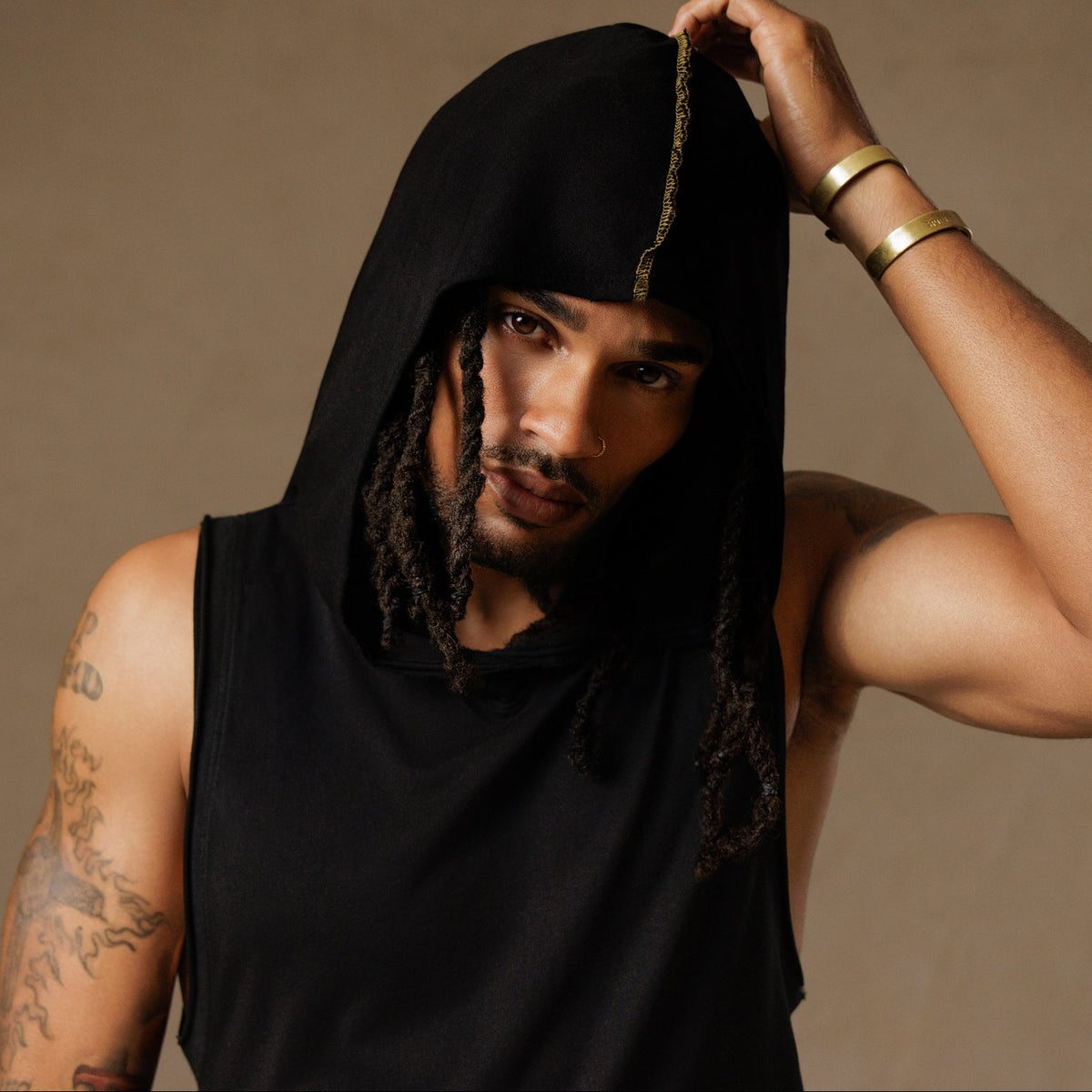 male modeling black hooded tree tank