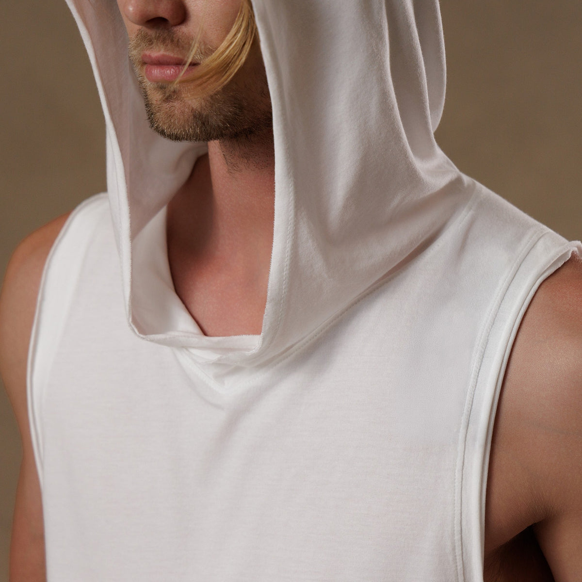 male modeling white hooded tree tank