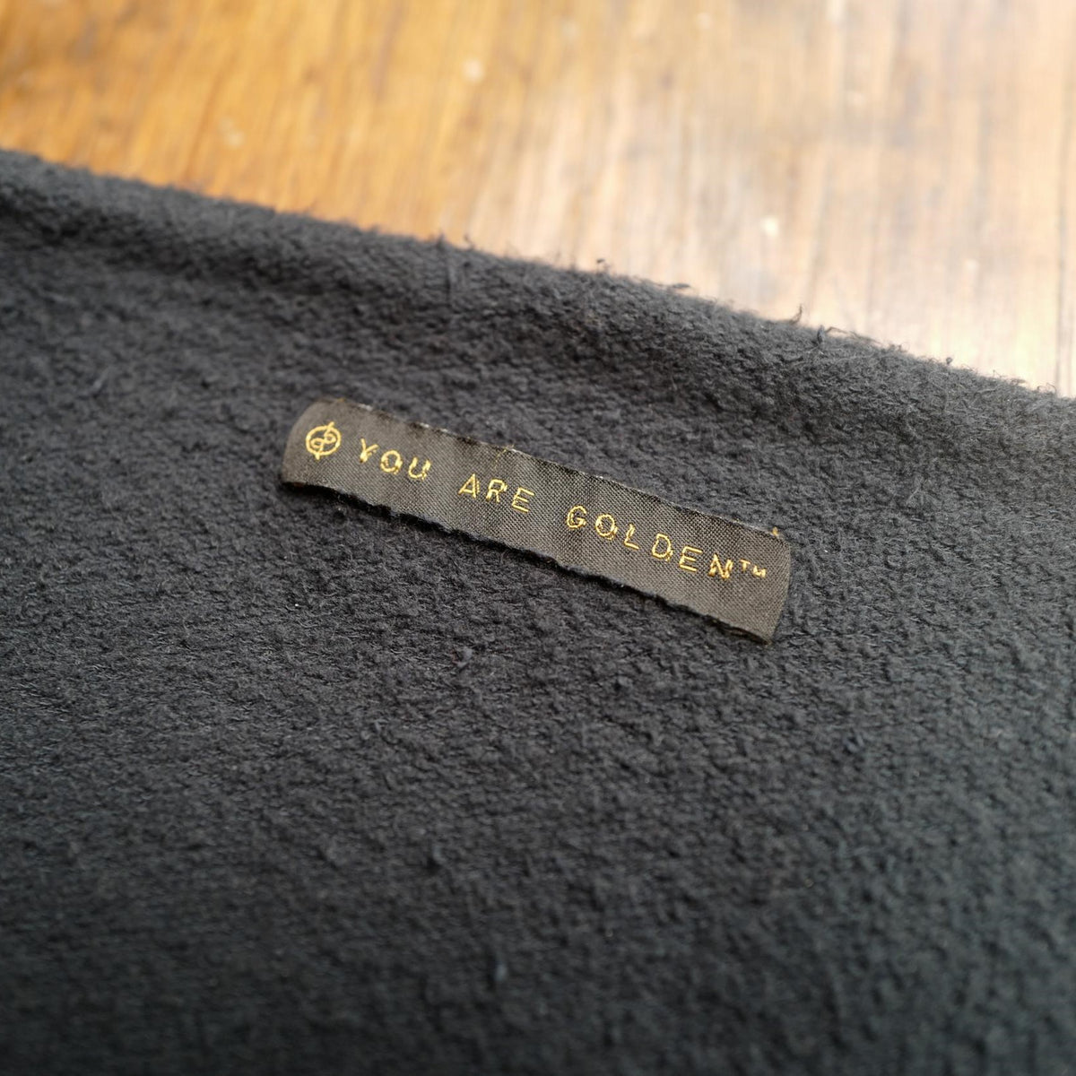 The One Golden Thread OG Cloud Beanie in Slate with the saying "You are golden"