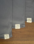 Flat lay of ultimate tee three pack in deep clay