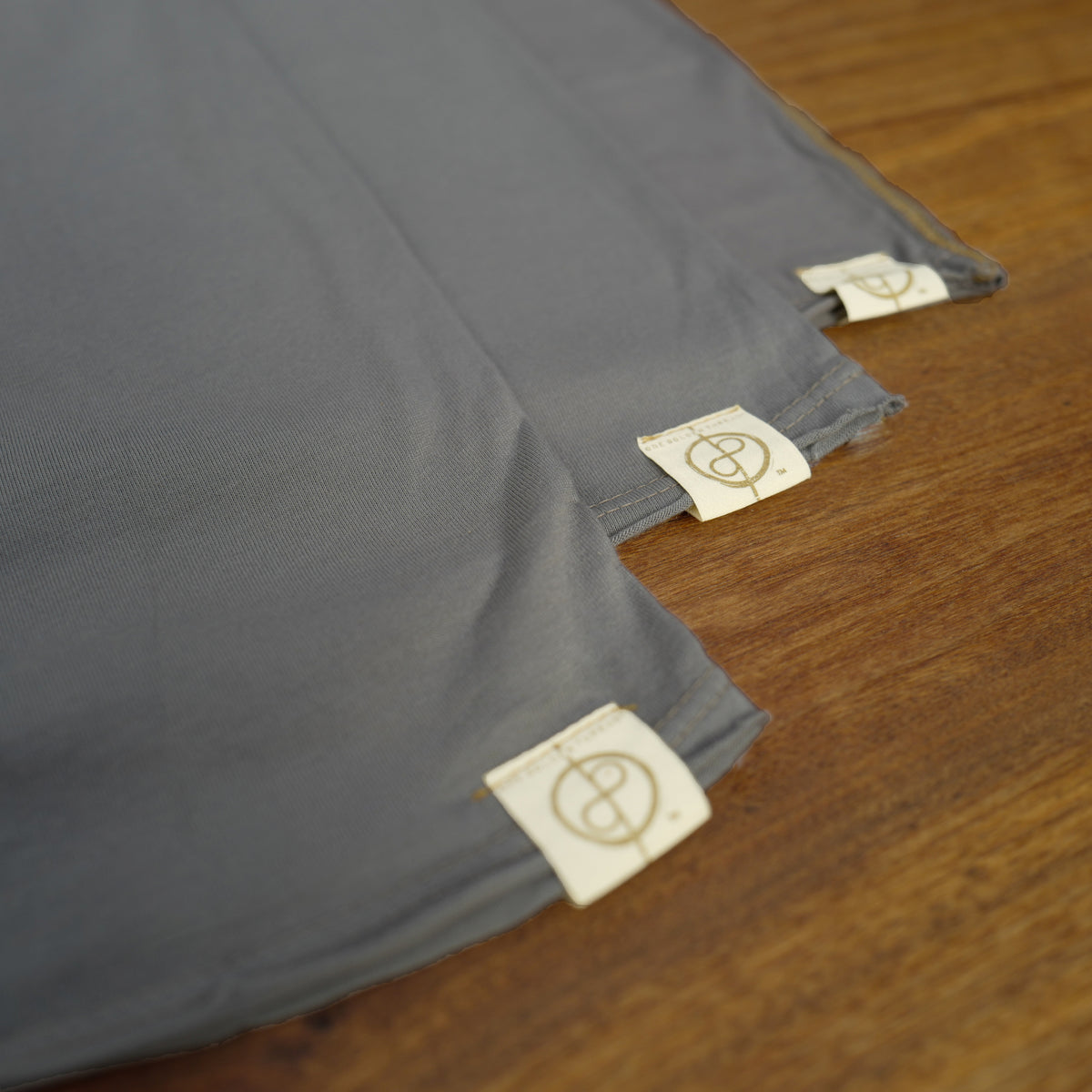 Flat lay of ultimate tee three pack in deep clay