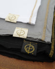 Flat lay of ultimate tee three pack in different colors