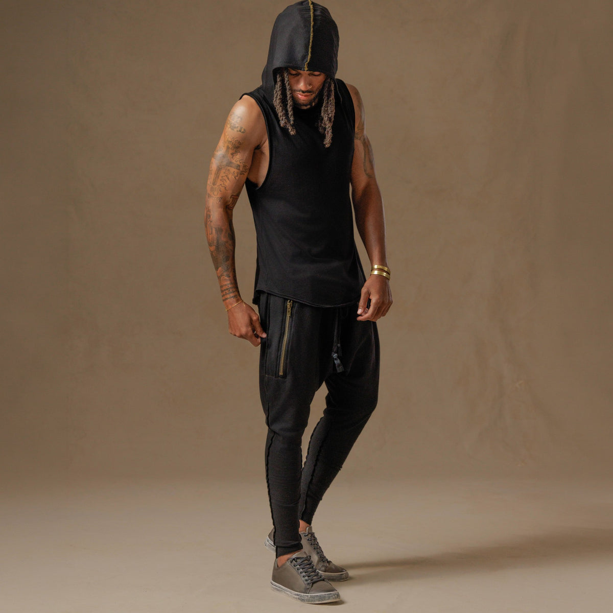 male modeling black hooded tree tank