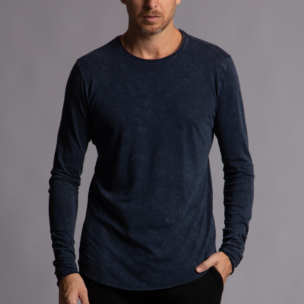 Man modeling a long sleeve crew shirt in charcoal blue