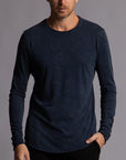 Man modeling a long sleeve crew shirt in charcoal blue