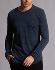 Man modeling a long sleeve crew shirt in charcoal blue