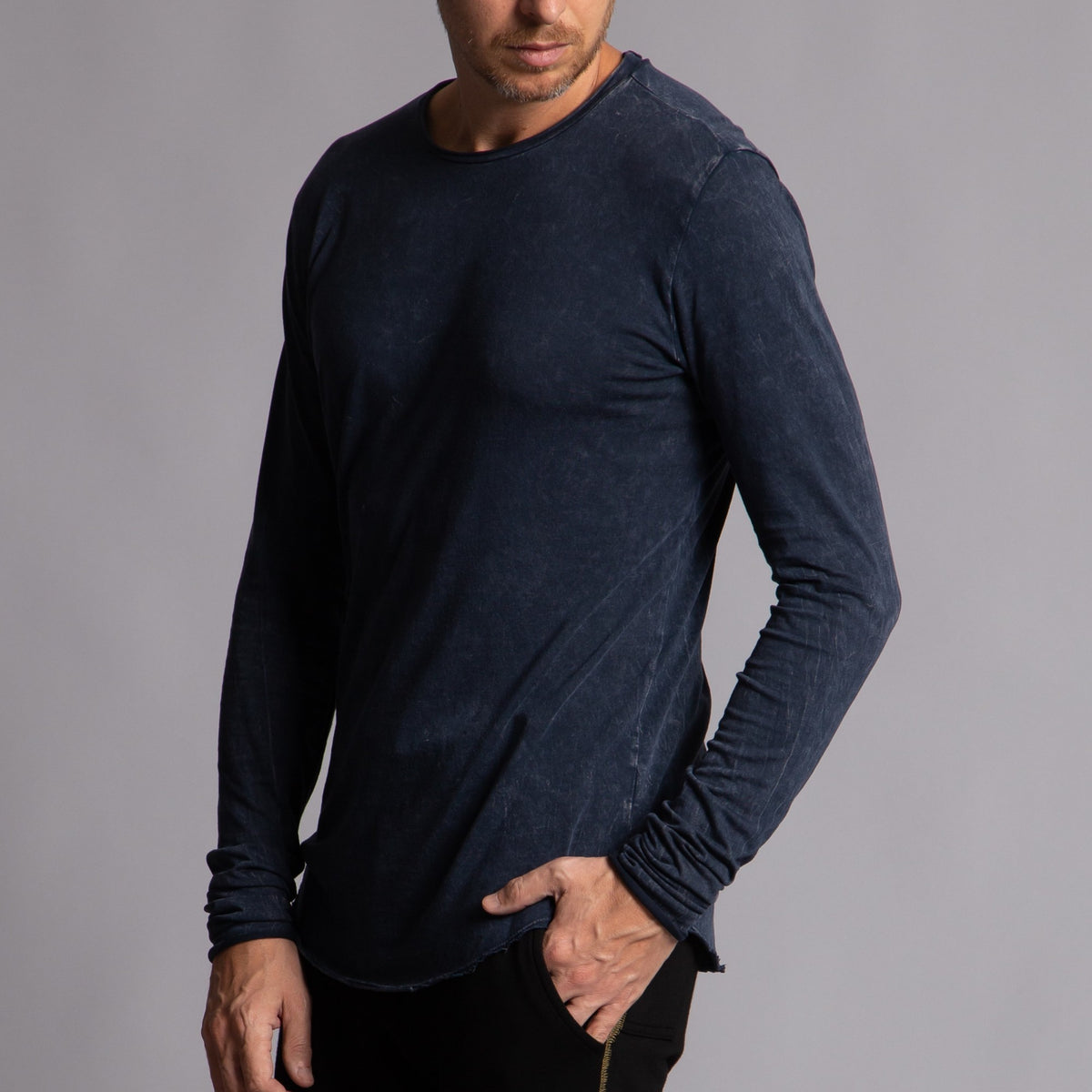 Man modeling a long sleeve crew shirt in charcoal blue