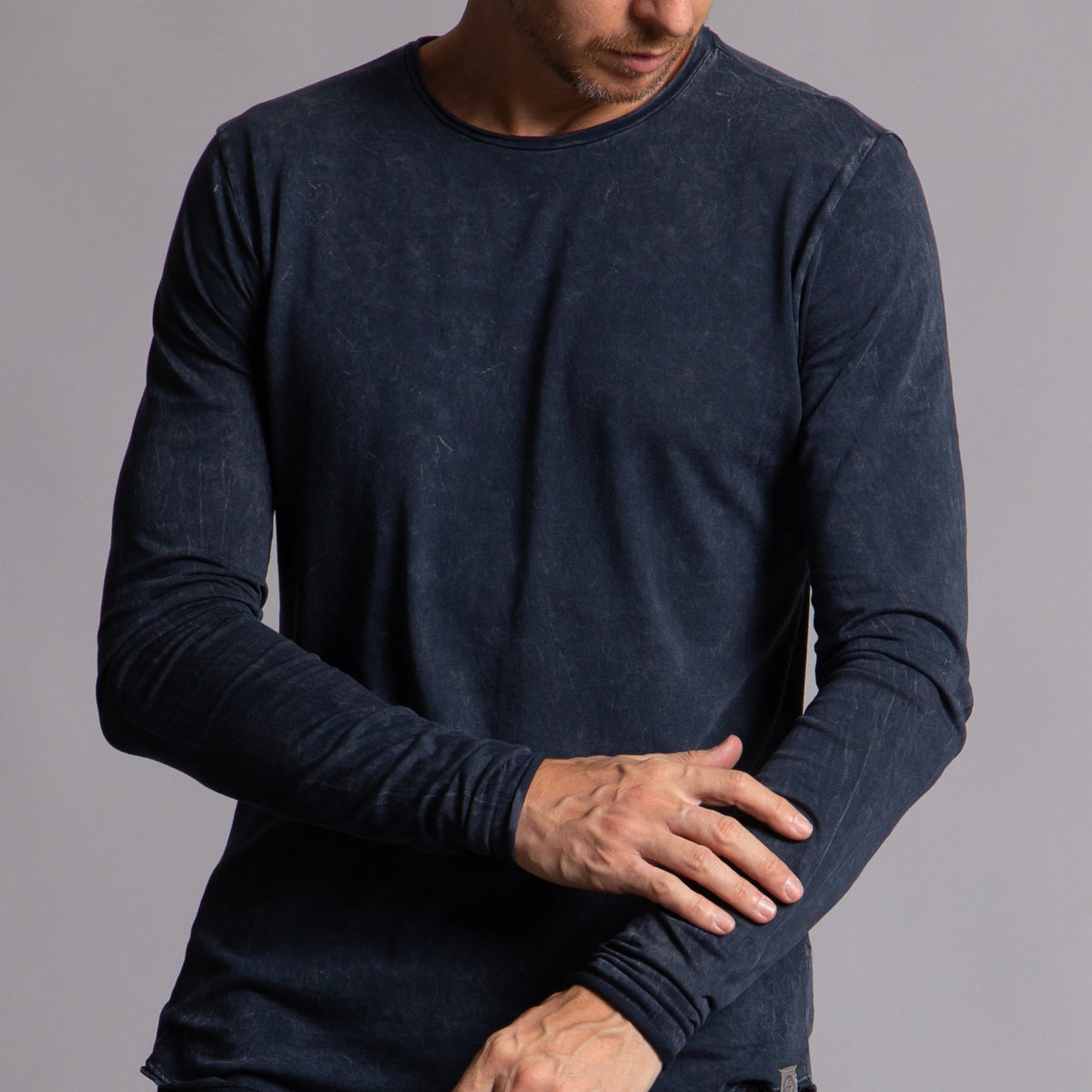 Man modeling a long sleeve crew shirt in charcoal blue