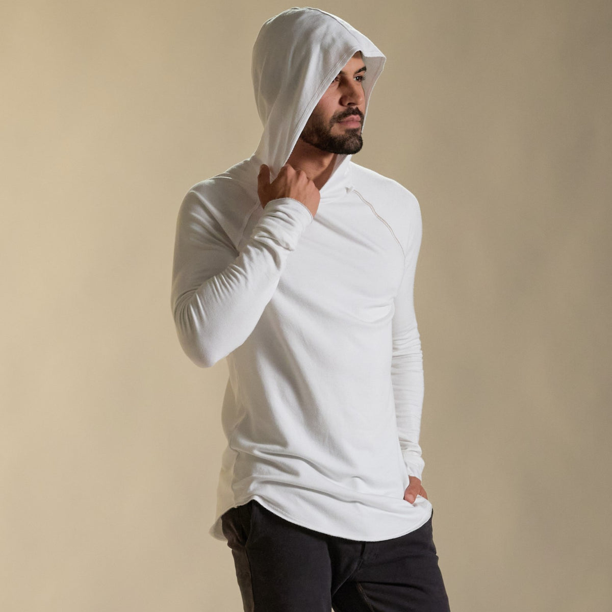 Man modeling white long-sleeve hooded tee