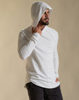 Man modeling white long-sleeve hooded tee