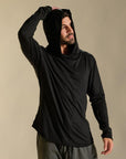 Man modeling black long-sleeve hooded tee