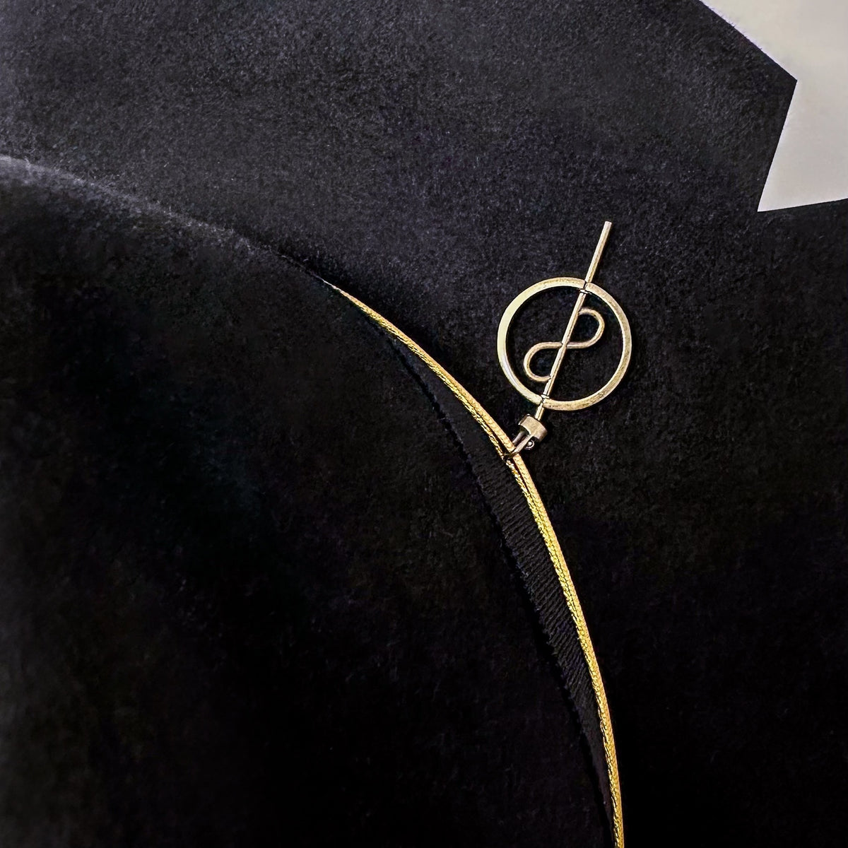 Closeup of OGT Bespoke Hat with 108 Talisman