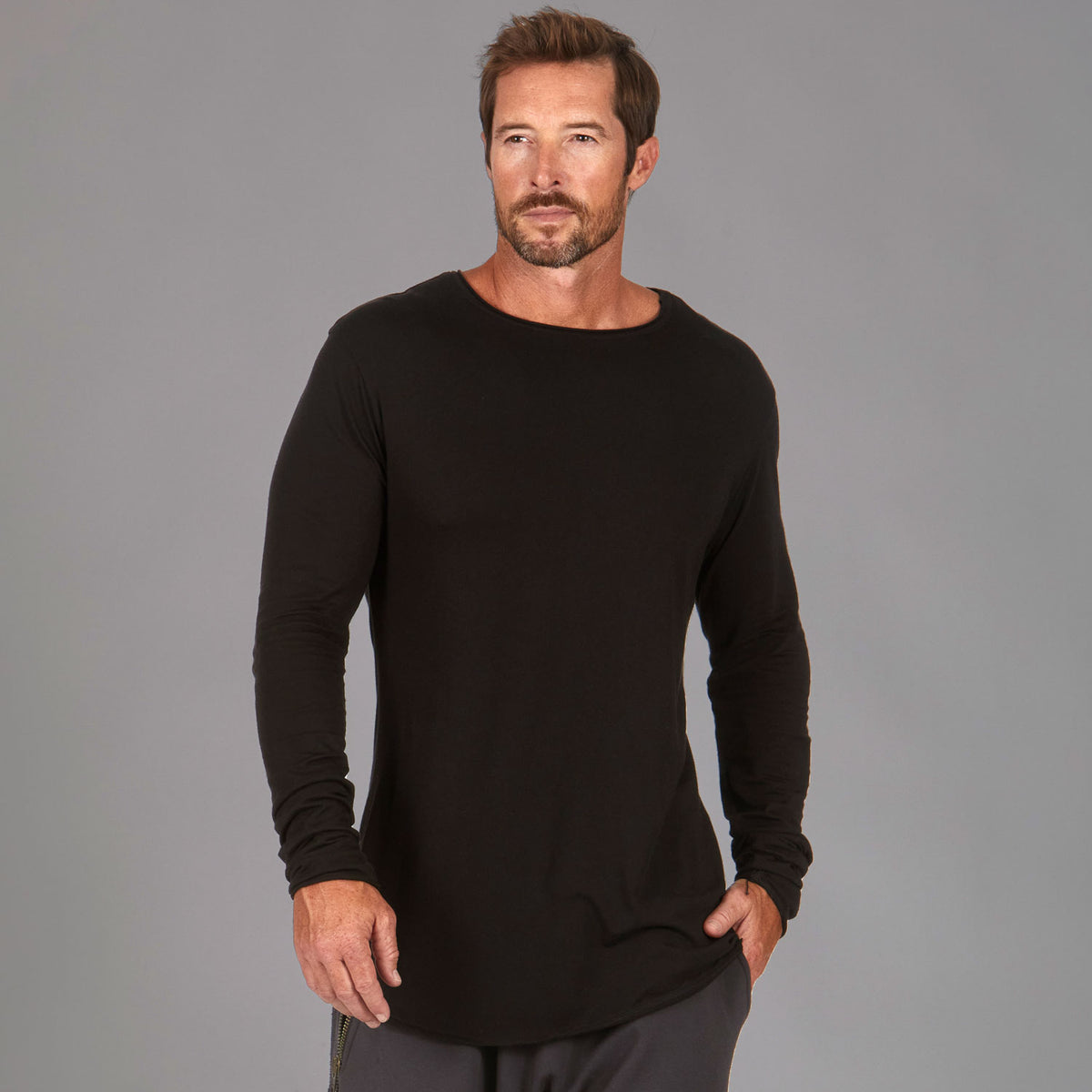 Man modeling a long sleeve crew shirt in black