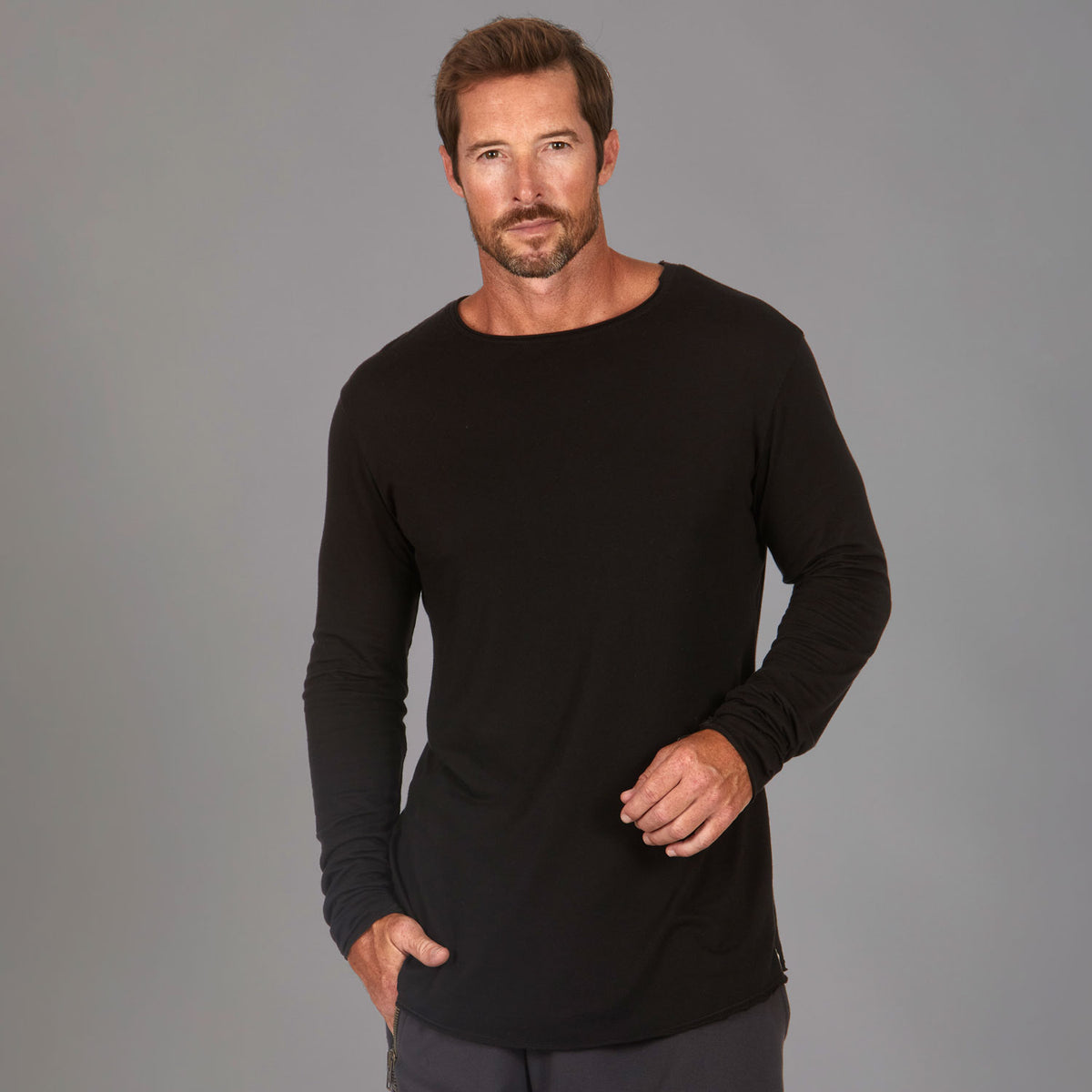 Man modeling a long sleeve crew shirt in black