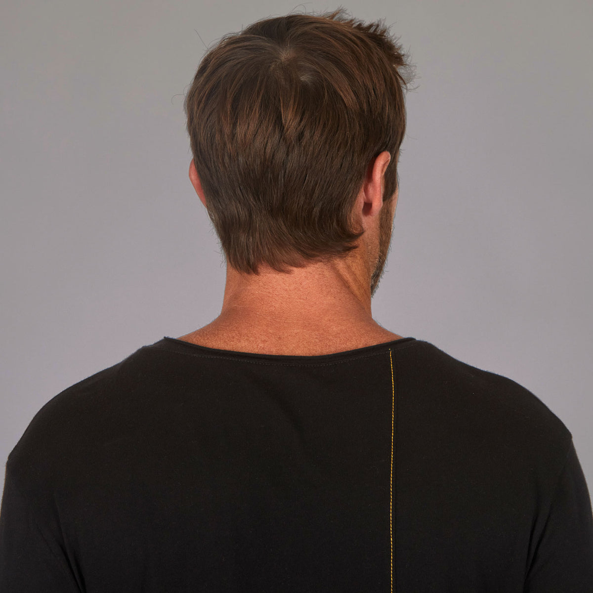 Man modeling a long sleeve crew shirt in black