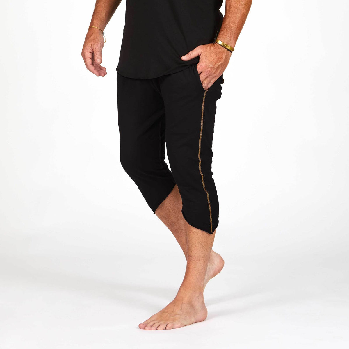 Male modeling black yogo mid shorts