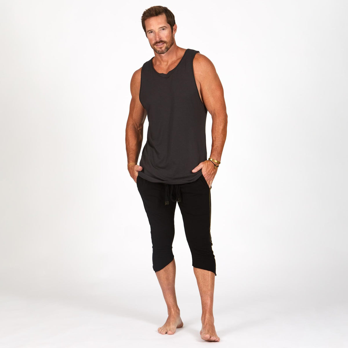 Male modeling black yogo mid shorts