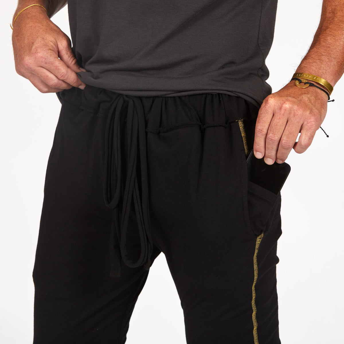 Male modeling black yogo mid shorts