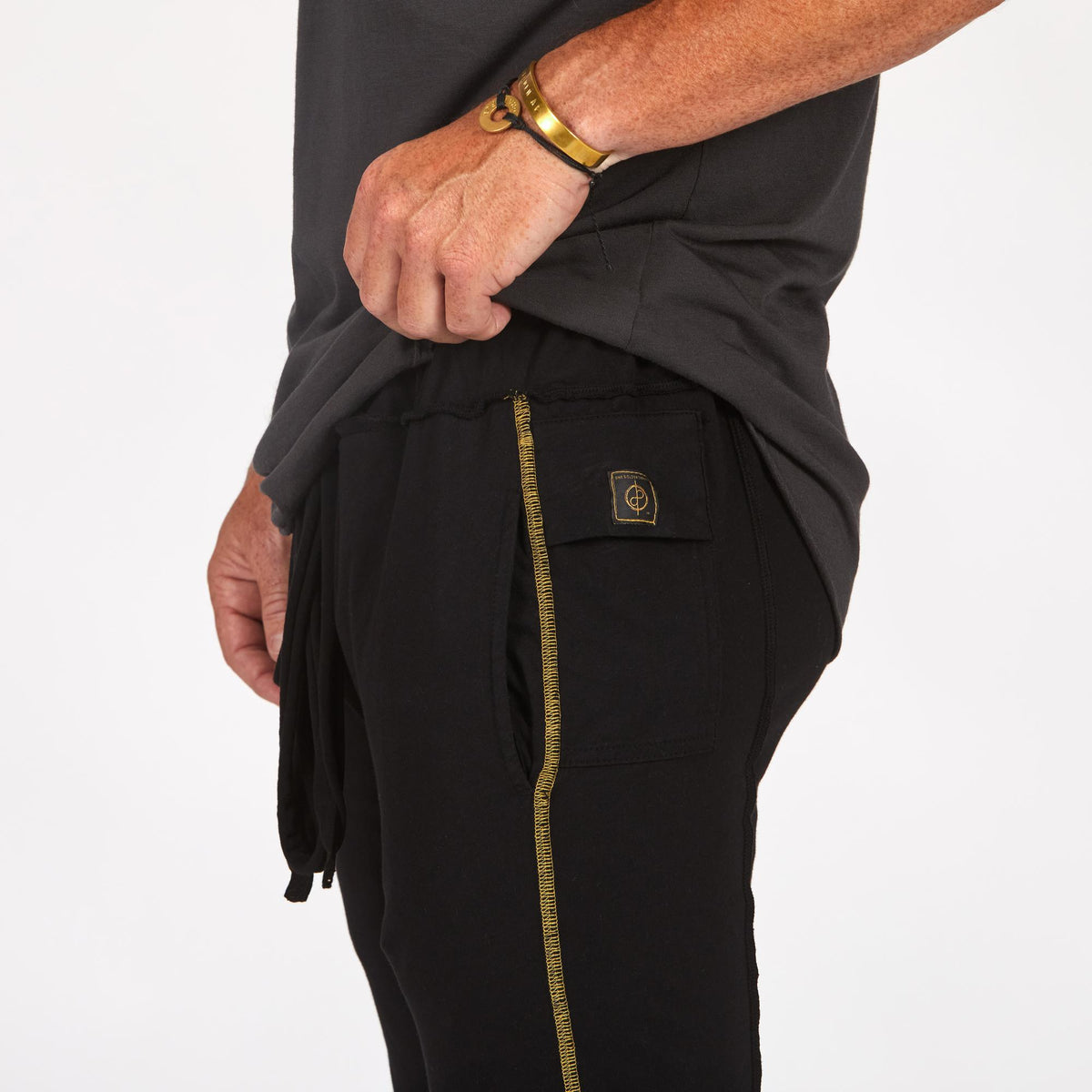 Male modeling black yogo mid shorts