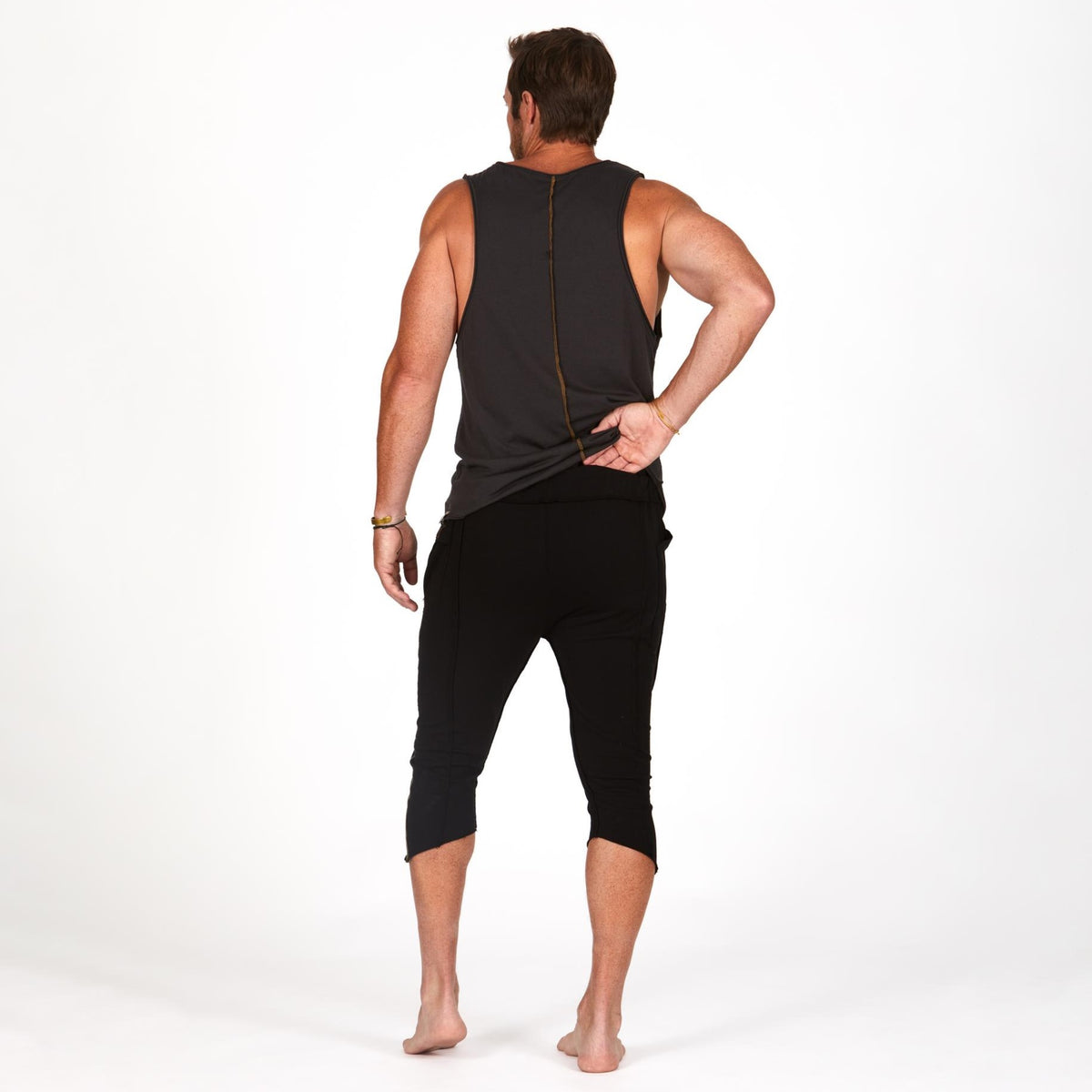 Male modeling black yogo mid shorts